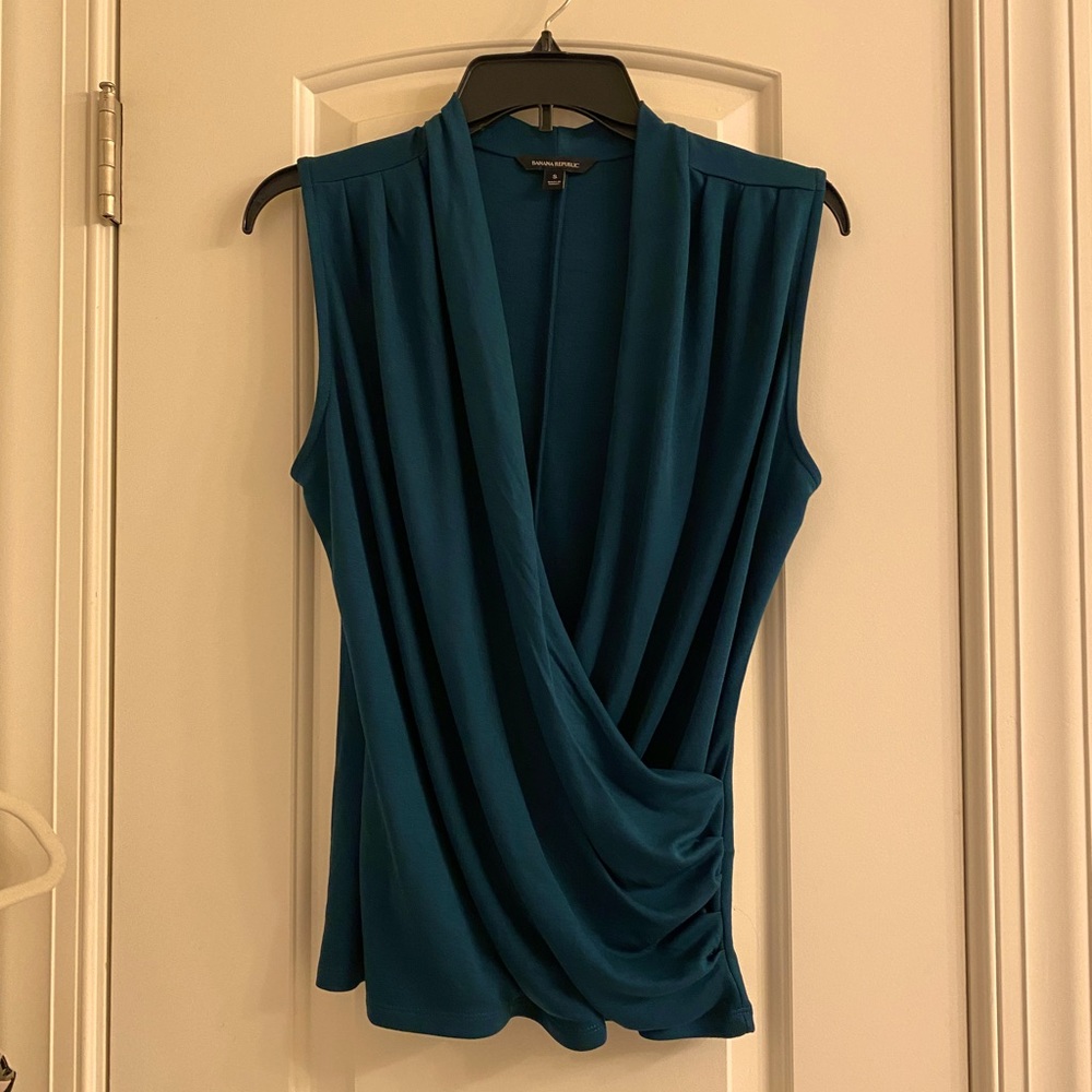 Draping wrap top in a dark green color ,not a teal